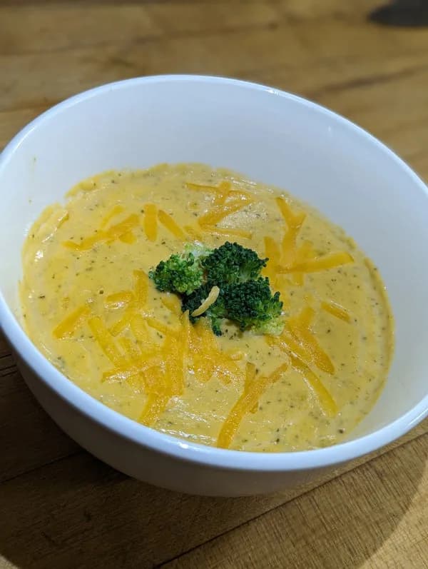 Bowl of Sherm's broccoli cheddar soup, a comforting ready-to-heat meal