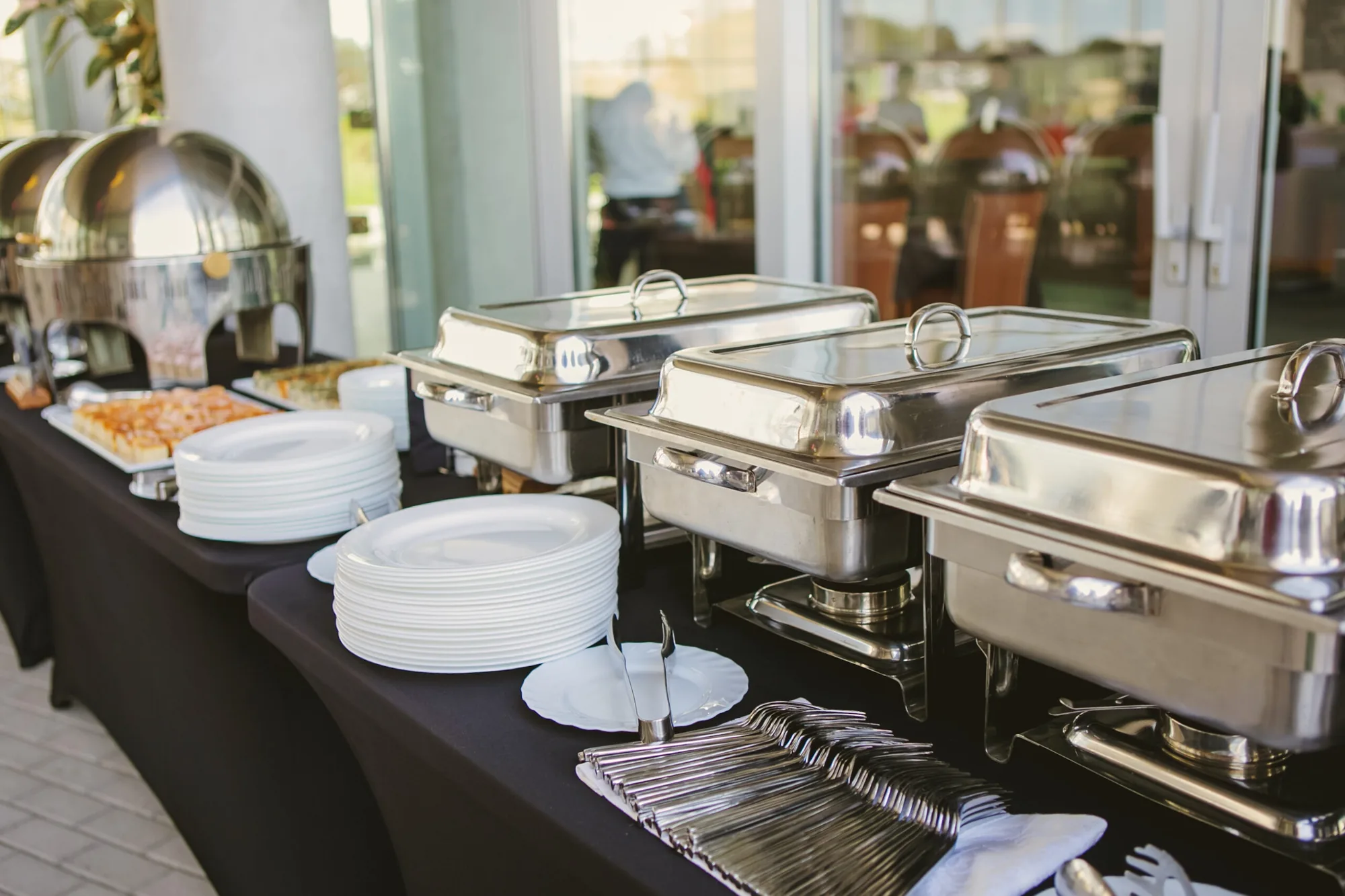 Full hot buffet with chafing dishes set up by Sherm's Catering for a Delaware corporate event